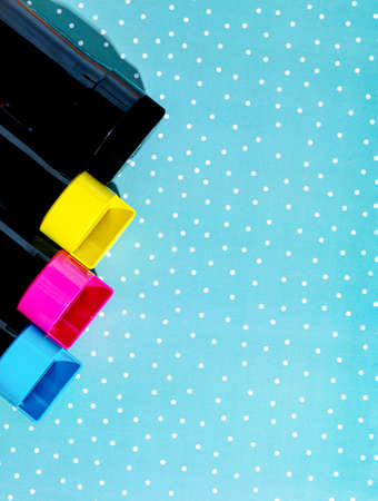 A set of toner cartridges for a color laser printer on a snowy background. Bright creative concept christmas minimalの写真素材