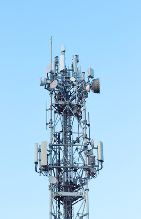 5G antenna is located against the sky. New technologiesの写真素材