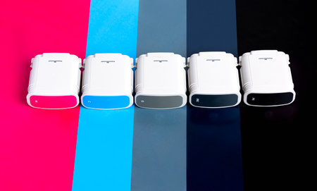 Cartridges for wide format plotter on the background of SMYK. Bright creative concept minimalの写真素材