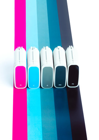 Cartridges for wide format plotter on the background of SMYK. Bright creative concept minimal. View from aboveの写真素材