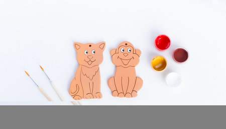 Drawing a cat and a monkeyon on clay figures. Creativity for children.の写真素材
