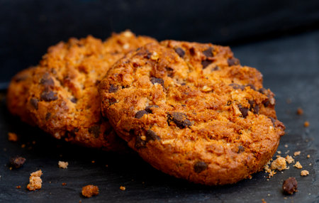 Biscuits with chocolate on rustic table.Biscuits sweet cookie background.の写真素材