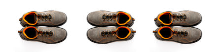Creative composition of protective footwear on an isolated gray background with space for text. Work shoes for men in factories or industry to protect feet from accidents.の写真素材