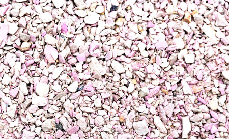 Filler for cat litter box, showcasing textured granules in soft pink and beige hues, ideal for pet care and hygiene, enhancing comfort for feline companionsの写真素材