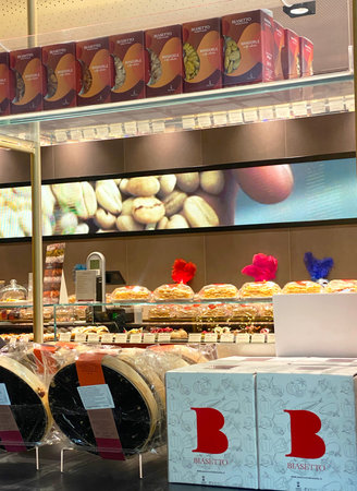 Padova, Italy - January 19, 2025: A stand at the Biasetto bakery, a renowned Italian pastry shop. Cakes and other desserts are displayed in packaging and boxes bearing the "BB Biasetto" logo.のeditorial素材