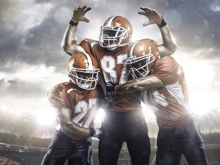 American football players in action on the stadiumの写真素材