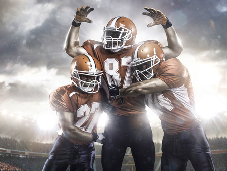 American football players in action on the stadium