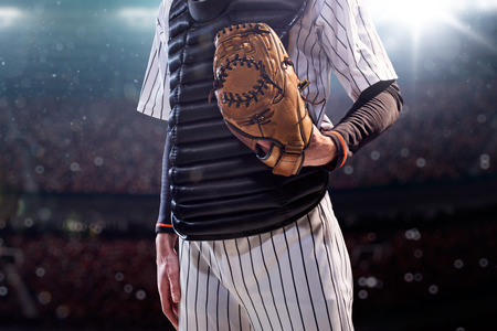 Professional baseball player in action on grand arenaの写真素材