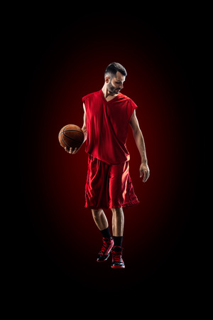 basketball player in action Isolated on blackの写真素材