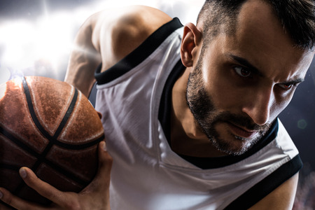 basketball player in action Isolated on black の写真素材
