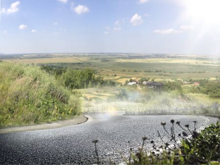 Road turn sunny morning vilage background blue skyの写真素材