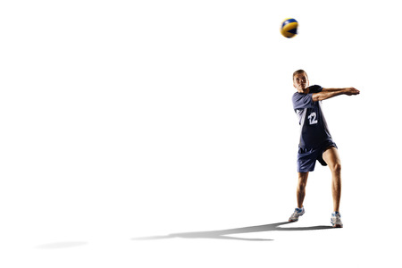 Professional valleyball player in action isolated on whiteの写真素材