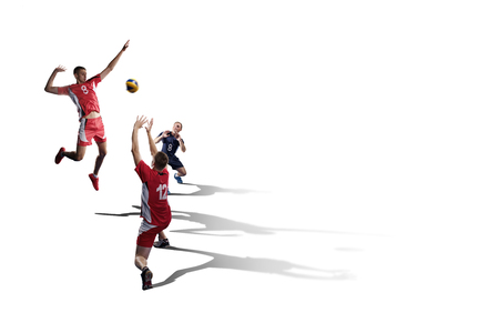 Tree professional volleyball players in action isolated on whiteの写真素材