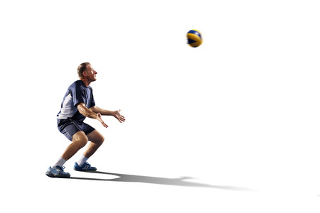 Professional valleyball player in action isolated on whiteの写真素材