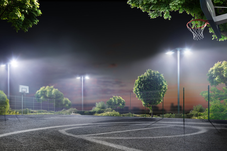 Streetball school arena in the night lightsの写真素材