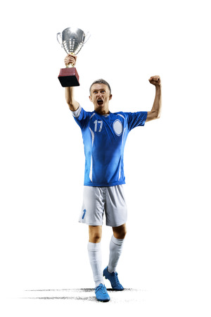 Professional soccer player with cup celebrating on white background.の写真素材