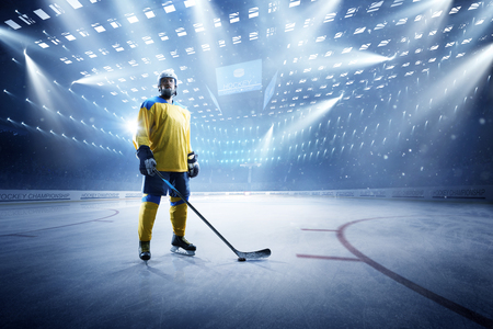 Ice hockey player on the grand ice arenaの写真素材