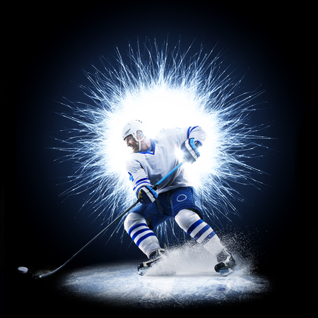 Ice Hockey player is skating on a abstract backgroundの写真素材