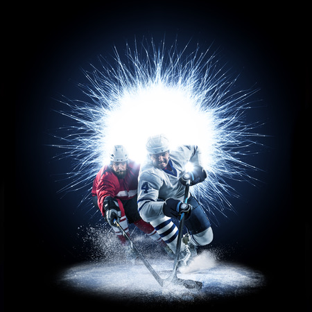 Ice Hockey players are skating on a abstract backgroundの写真素材