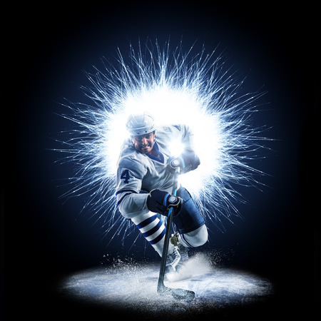 Ice Hockey player is skating on a abstract backgroundの写真素材