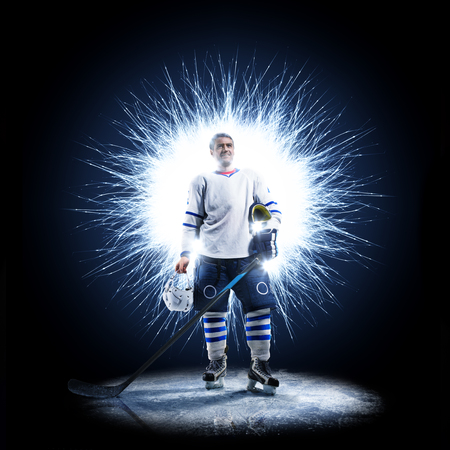 Ice Hockey player is skating on a abstract backgroundの写真素材