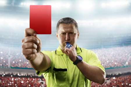 Referee showing the red card in the soccer stadiumの写真素材