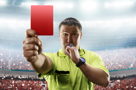 Referee showing the red card in the soccer stadiumの写真素材