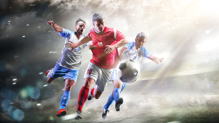 Soccer players in action on the grand stadium background panoramaの写真素材