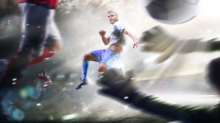 Soccer players in action on the grand stadium background panoramaの写真素材