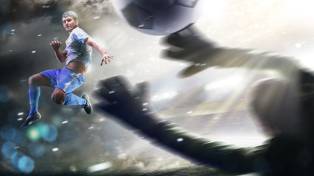 Soccer players in action on the grand stadium background panoramaの写真素材