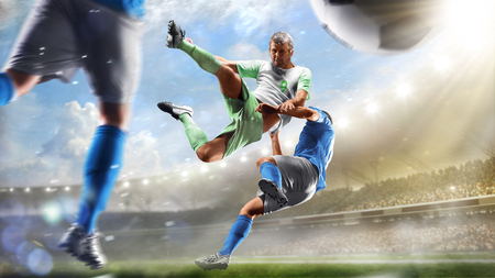 Soccer players in action on the day grand stadium background panoramaの写真素材