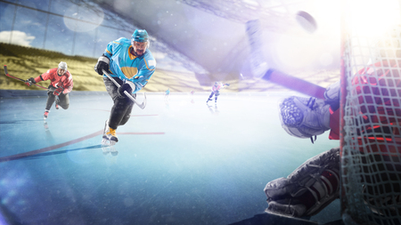 Professional hockey players in action on grand arenaの写真素材