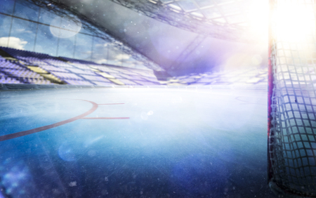 ice hockey stadium with lights crowd and an empty ice rinkの写真素材