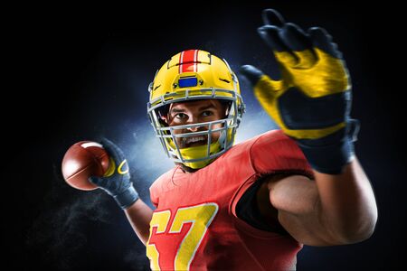 Proud american football player in the darkの写真素材