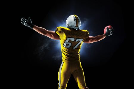 Proud american football player in the darkの写真素材