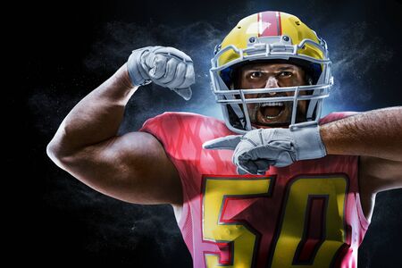 Proud american football player in the darkの写真素材