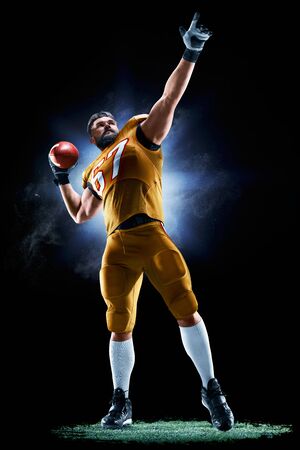 Proud american football player in the darkの写真素材