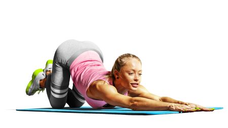 Professional fitness woman working out and stretching isolated on white backgroundの写真素材