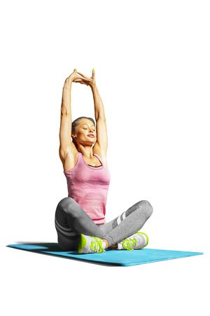 Professional fitness woman working out and stretching isolated on white backgroundの写真素材