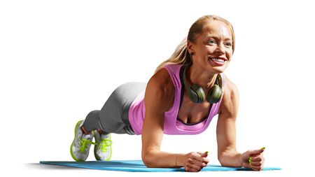 Professional fitness woman working out and stretching isolated on white backgroundの写真素材
