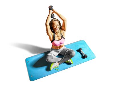 Professional fitness woman working out and stretching isolated on white backgroundの写真素材