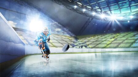Professional hockey player in action on grand arenaの写真素材