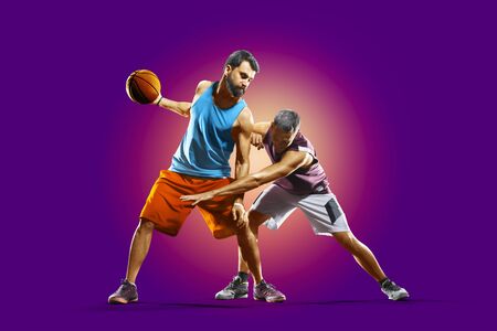 colourful professional basketball players isolated over purple backgroundの写真素材