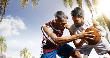 day light professional basketball players in the actionの写真素材