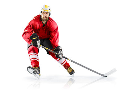 Professional ice hockey player on defending position on the rink. Isolated image on whiteの写真素材