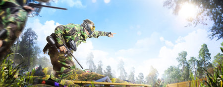 Professional paintball player in action outdoorの写真素材