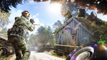 Professional paintball player in action outdoorの写真素材