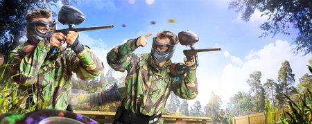 Professional paintball player in action outdoorの写真素材