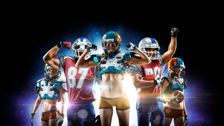 Professional american football players male and female posing together isolated on the black backgroundの写真素材