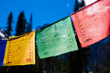 Colorful backlit Himalayan prayer flagsの写真素材